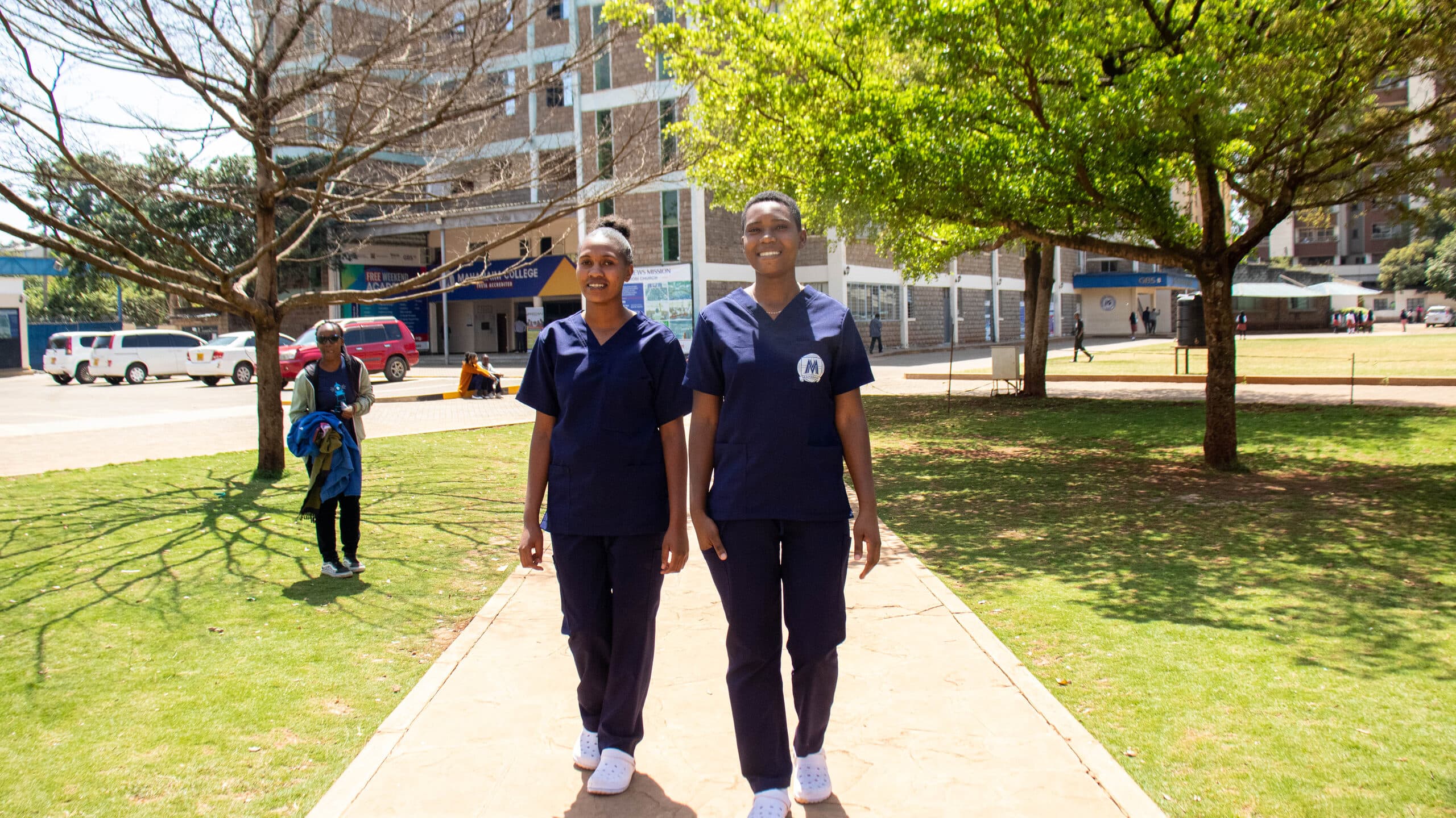 Two Mahanaim College students walking together on campus