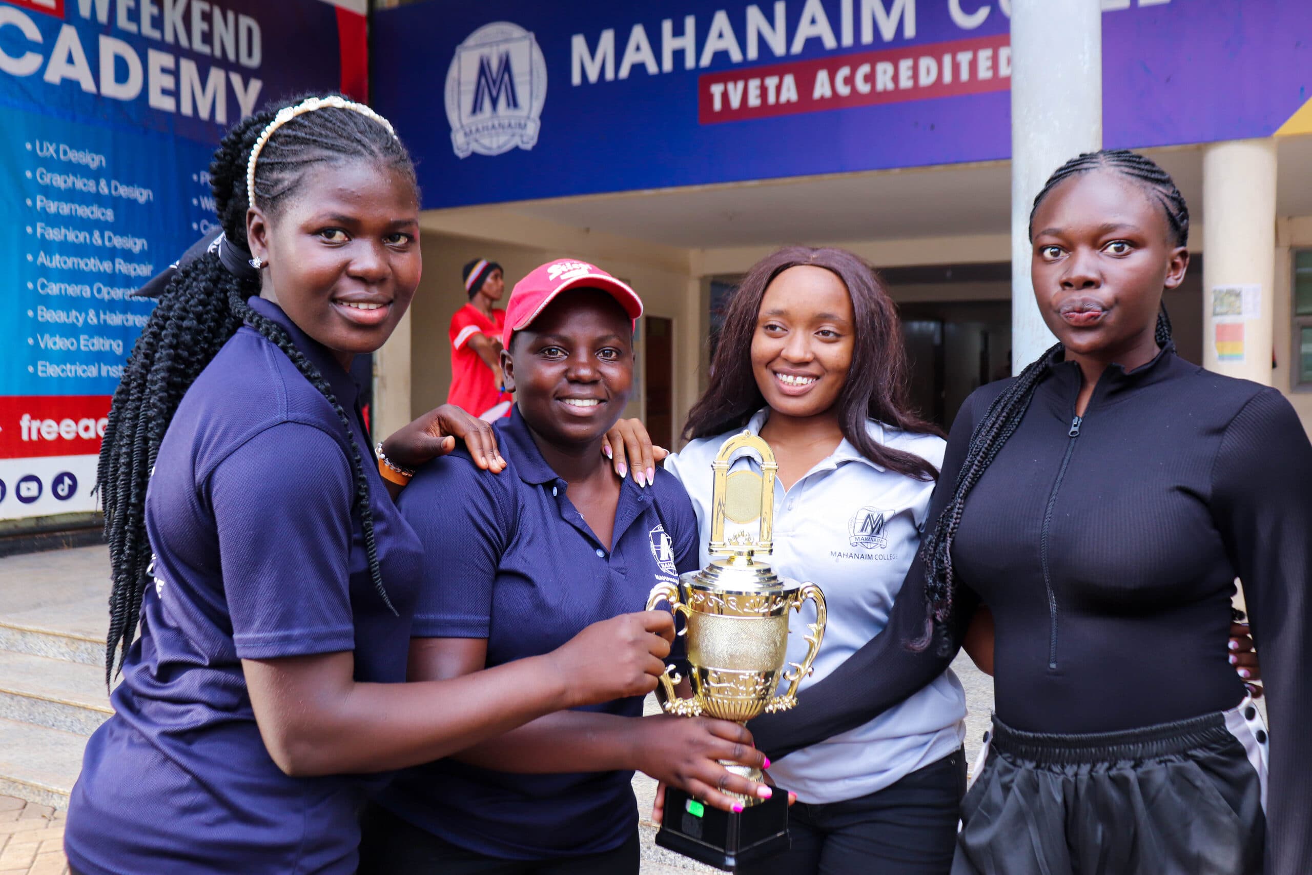 Mahanaim College students with a sports trophy